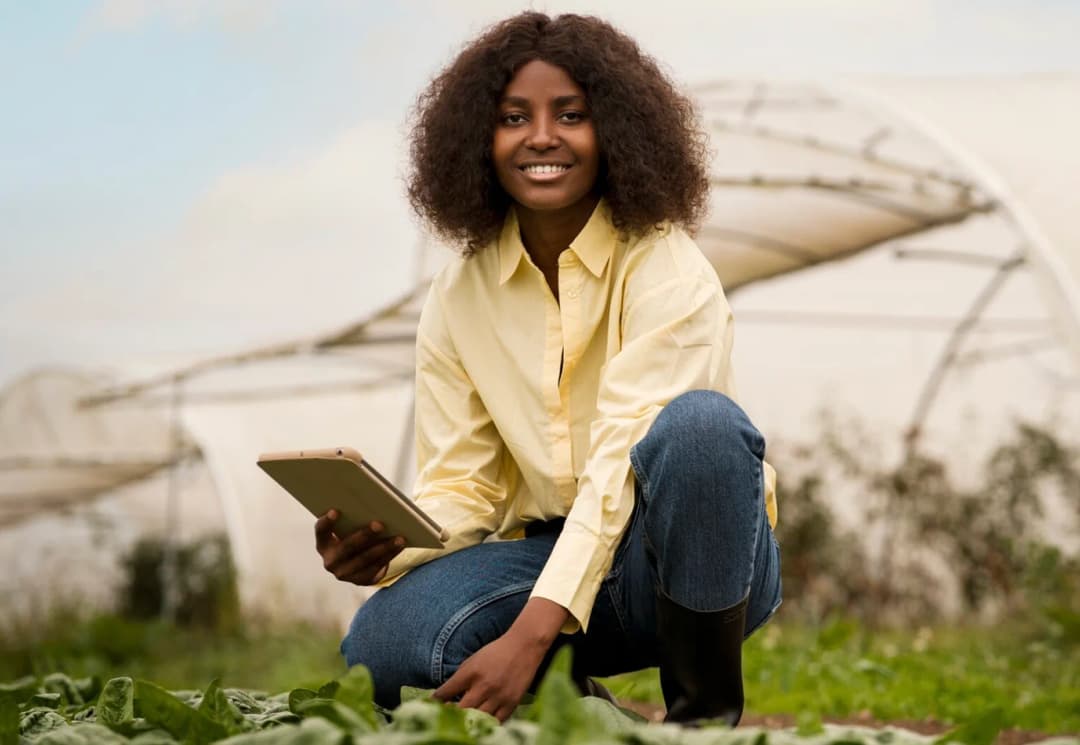 a lady working on a farmland