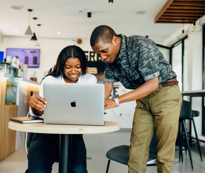 a man and woman using a computer